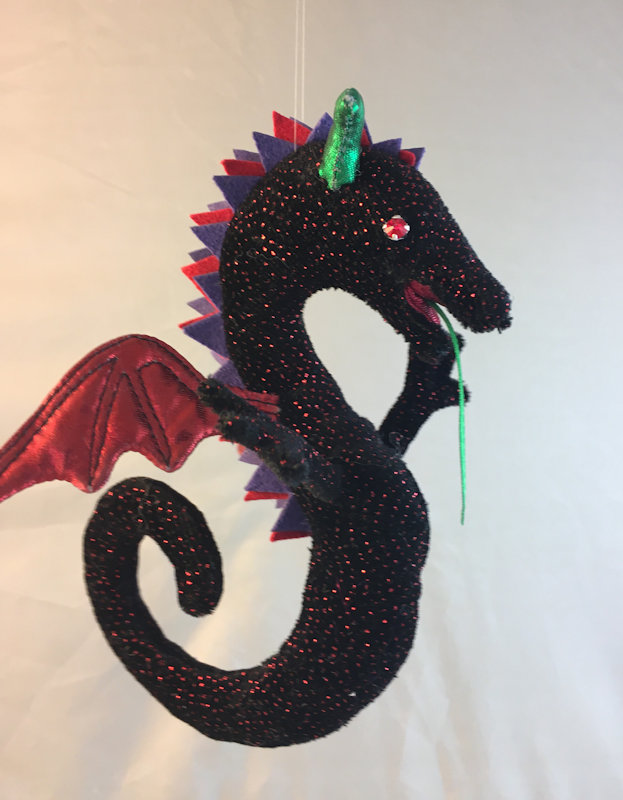 Wyvern in black with ruby sparkles